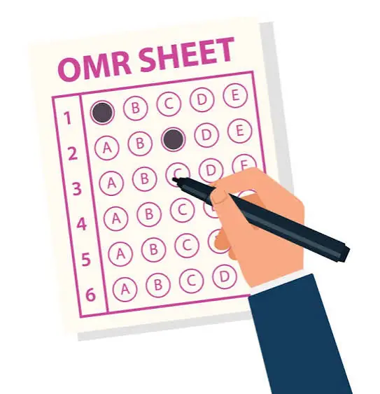 Hand marking an OMR answer sheet